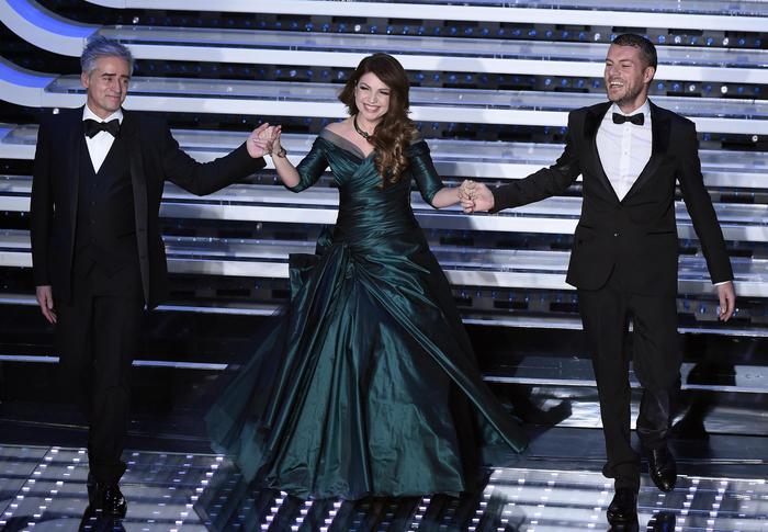 Italian singer Cristina D'Avena (C) performs on stage during the Sanremo Italian Song Festival at the Ariston theater in Sanremo, Italy, 13 February 2016. The 66th Festival della Canzone Italiana runs from 09 to 13 February. ANSA/CLAUDIO ONORATI